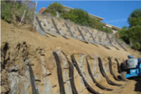The repair and stabilization of a slope or hillside